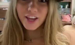 BreckieHill in a cowboy suit with big breasts