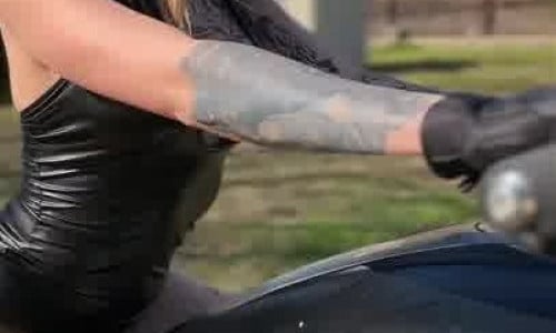 Justpeechi Sits On A Motorcycle