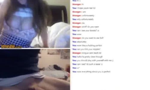 Sexy girl with big breasts lifts her mini skirt